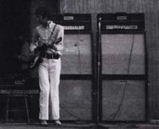 Two Marshall JTM45 100 Tremolo (1959T JTM100 Tremolo Super Lead) heads (one block logo, one script logo) and two Marshall 8×12 cabinets (one script logo, one block logo.