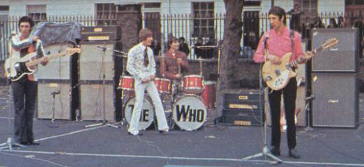 John Entwistle, with two Marshall JTM45 100 100w heads and two Marshall 8×12 cabinets; Pete with one Marshall JTM45 100 100w Tremolo head (top), one 1967 Marshall Major (“Pig”) 200w head (bottom) with one Marshall 8×12 cabinet, plus, to the right, Marshall 1982A angled 4×12 100w cab (top) and Marshall 1982B (extra tall) straight 4×12 100w cab. Pete’s guitar is 1965 or 1966 Rickenbacker 360/12 Mapleglo.