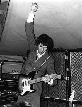 Ca. 1967, multiple shots of two customised Sound City L100 amplifiers, each with different blockscript Sound City nameplate badge; topped by a Grampian Reverb unit. Speakers cabinets are four Sound City 200w 4×12 cabinets, evidently held together with gaffer’s tape. –1