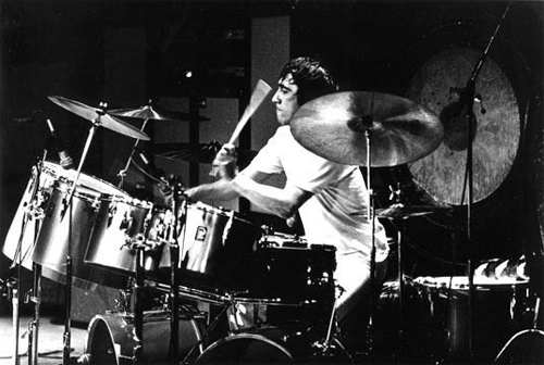 Gold-colored kit featuring outer row of single-headed (concert) toms.