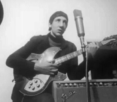 Ca. 1965, conducting an interview next to Fender Bassman top. Guitar is 1964 Rickenbacker 360/12 Export.