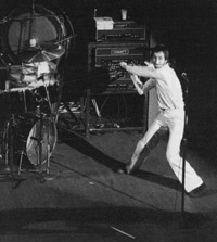 Click to view larger version. Gibson Les Paul Deluxe about to be smashed, at Newcastle Odeon, 5 November 1973. Courtesy Clint Nurse.