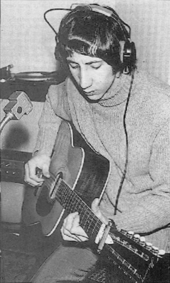 Ca. 1967, home studio, recording with the Harmony 12; C-style capo unused at the headstock.