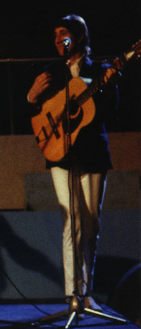 Ca. 1966, with the Harmony 12 during television performance. Note red capo at 2nd fret.