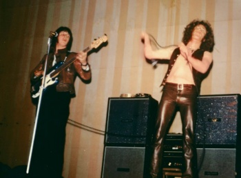 25 May 1969, photo of John playing a blue Fender Precision Bass with rosewood fingerboard