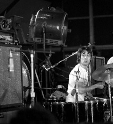 Close-up of large film lamp (off) behind Keith’s drumkit.