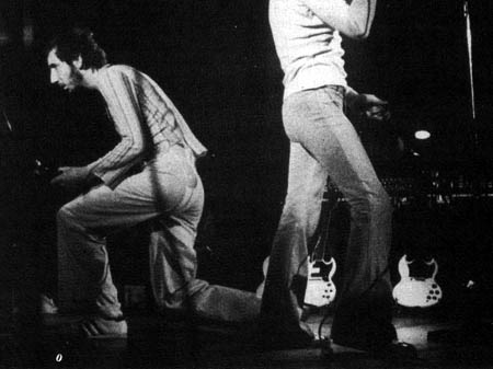 29 Oct. 1973, at Wolverhamton, UK, with two Polaris White Gibson SG Specials sitting stage-side. Left is pre-1966 model; right is 1966–1970 model. Courtesy Martin Forsbom.