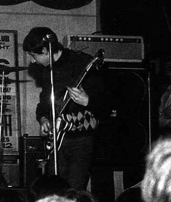 Ca. April 1965, a precursor to the actual “Marshall” stack, a blonde ’64 Fender Bassman head stacked on two Marshall 4×12 cabinets, one with British flag “grillecloth” and one with grillecloth completely removed.