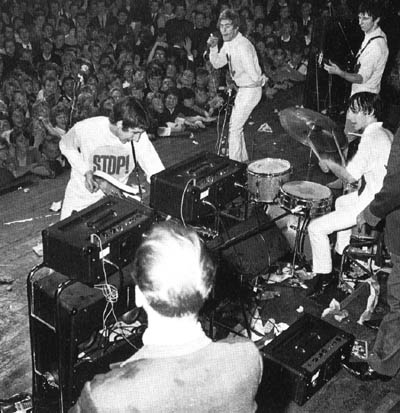 September 1965, spearing a Danelectro Guitarlin longhorn into a Vox AC-100 cabinet.