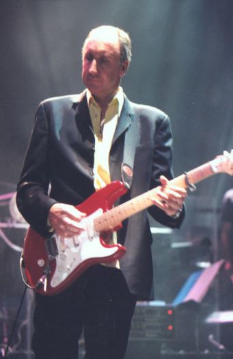 Ca. 1997, showing control knob for Fishman piezo transducer saddle-pickup system; Floyd Rose tremolo. Note the two Mesa-Boogie studio preamps in background.